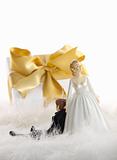 Wedding cake figures with gift on white