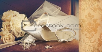 Wedding shoes with veil on velvet chair