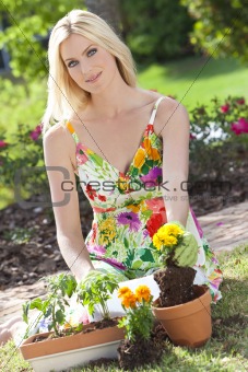 Beautiful Blond Woman Gardening Planting Flowers