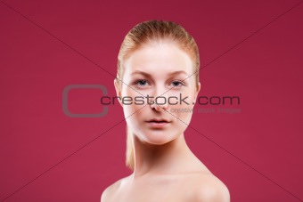 Portrait of a young lady on red
