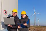 Two Engineers in Wind Turbine Power Generator Station