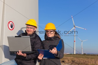 Two Engineers in Wind Turbine Power Generator Station