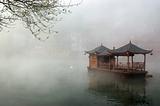 China landscape of boat on foggy river
