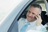 businessman in car talking on mobile phone