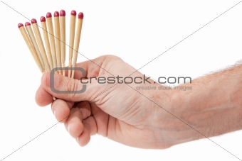Hand with matches on a white background