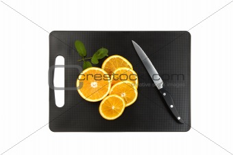 cutting board with oranges and mint