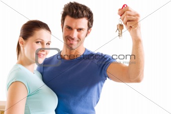 couple with the keys of the new home