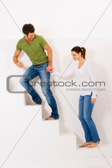 Couple up the stairs holding hands