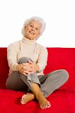elderly woman relaxing on the couch