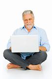 elderly man using laptop
