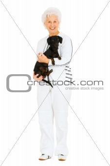 old woman with a dachshund in her arms