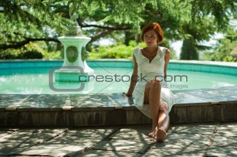 girl in a park near the fountain