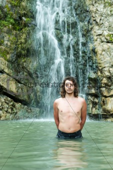 men and waterfall 