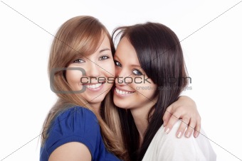 two happy young women standing, smiling - isolated on white