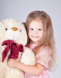 Little girl with teddy bear.