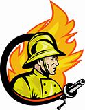 Fireman or firefighter with fire hose