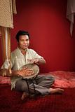 Indian Man Plays a Tabla