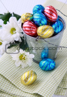 Bucket filled with chocolate eggs Easter sweets