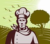 Organic Baker chef or cook with farm in background