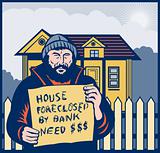 Homeless man or hobo sign foreclosed house