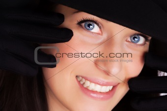 Portrait of a beautiful brunette young woman with gloves