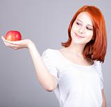 Girl with red apple in hand