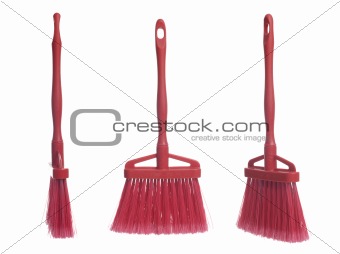 Three plastic red brooms
