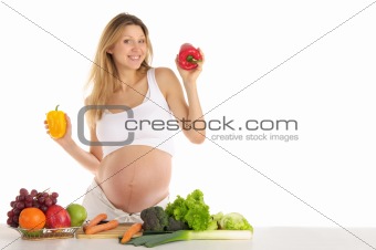 pregnant woman with fruits and vegetables