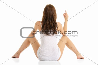 woman sitting on the floor and shows finger