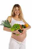 happy pregnant woman with fruits and vegetables