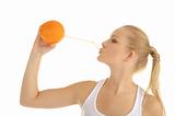 woman drinking orange juice through a straw