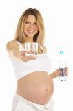 pregnant woman holds out a glass of water