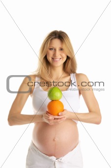 pregnant woman with apples and oranges