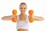 woman engaged in fitness dumbbells of oranges