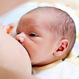 Breastfeeding newborn baby boy