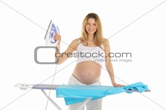 pregnant woman in a white suit with an iron