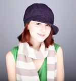 Style girl in cap. Studio shot.