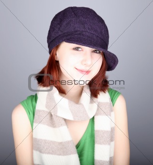 Style girl in cap. Studio shot.