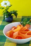 Carrot salad in white bowl  wiath basil