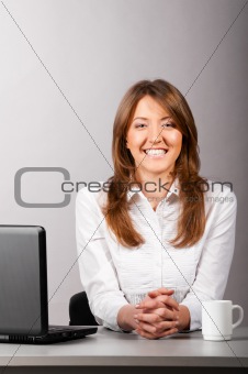 woman at office with laptop