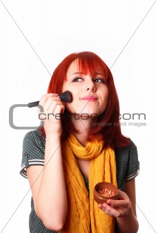 Girl with scarf making make-up