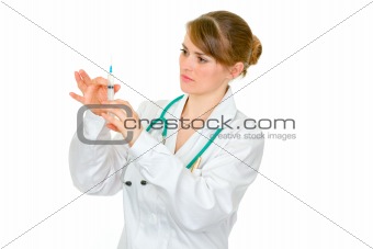 Concentrated doctor woman preparing  to inoculate
