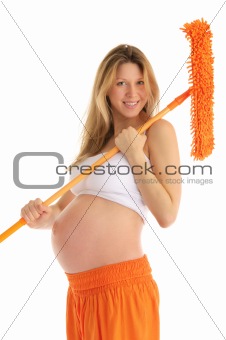 happy pregnant woman with a mop and brush