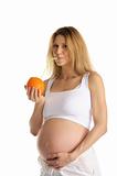 pregnant woman drinking juice from the orange