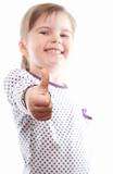 little girl showing thumb up