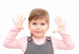 little girl rises hands up and shows ten fingers