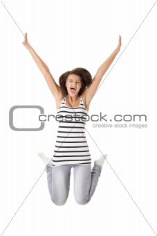 Young happy caucasian woman jumping in the air