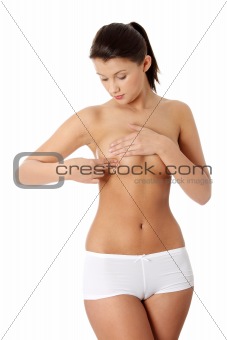 Woman checking her breast 