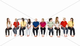Group of women on chairs in a line