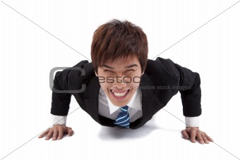 Young happy businessman make push-ups  and fitness